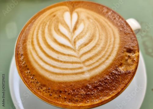 Close-up a cup of hot latte art simple tulip coffee, background and texture.