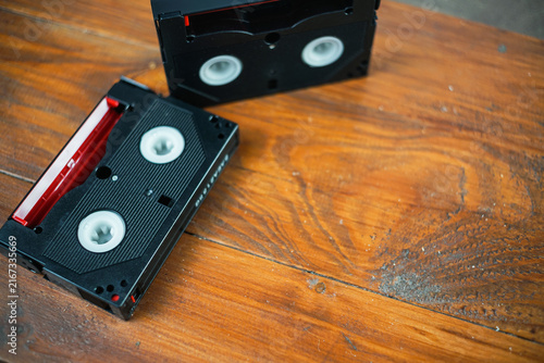 Vintage cassette tapes and camera on wooden desk