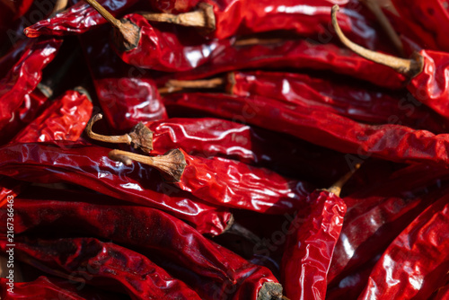 Dried chili peppers on traditional indonesian woven bamboo basket (besek), prepared to make sambal (spicy sauce), chili oil, or other hot dishes