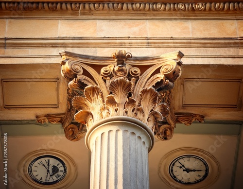 a close up of a column with a clock on it