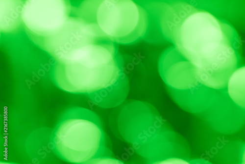  Bright green bokeh texture with glowing circular light shapes.
