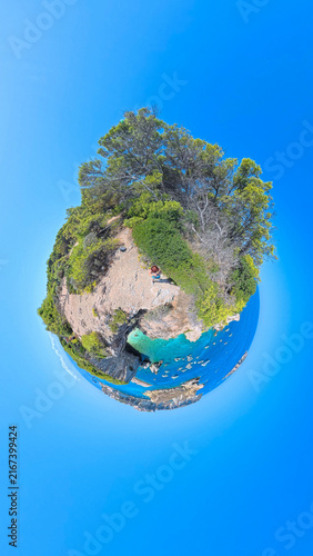 360 Degree Tiny Planet View of Cala dei Pagliai in Tremiti Islands, Apulia, Italy – Creative Stereographic Projection of Turquoise Sea, Cliffs and Pine Trees Under Blue Sky