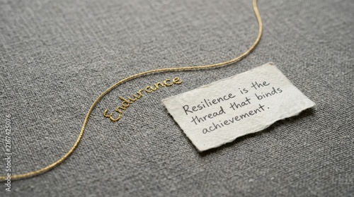 Obraz w ramie Endurance quote on textured paper next to golden word