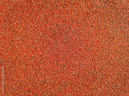 Photography Full frame view of rough red granulated surface texture