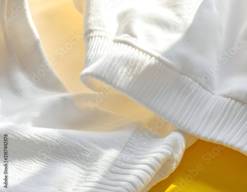 White sweatshirt ribbed cuffs and hem detail.