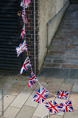 Union Jack British flags on ground after far right protest against illegal immigration in London