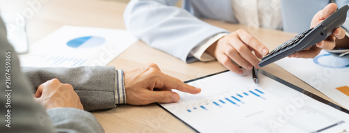 Картината върху платно Business meeting, asian group brainstorm analysis on graph data of cost plan