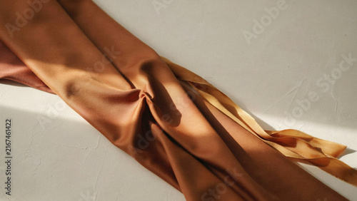 Warm Neutral Fabric Backdrop with Luxury Curtain and Natural Light for Elegant Brand Presentation