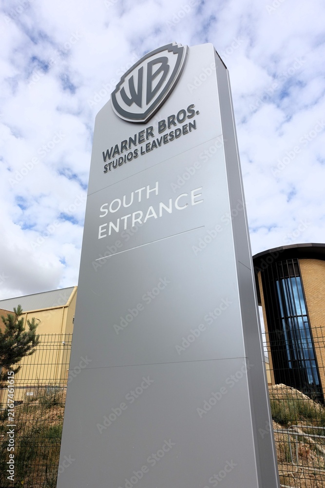 Fototapeta premium The sign at the south entrance of Warner Bros. Studios Leavesden marks an 80-hectare (200-acre) significant film and television studio complex situated in Hertfordshire, England.