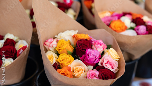 Colorful roses at a market stall, Rapperswil, Switzerland, farmers market. Flower shop, red, white, orange and yellow roses, flowers, blossom, freshness.