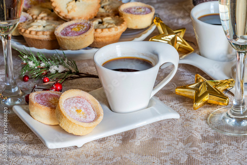 Christmas coffee with selection of gourmet cakes and champagne