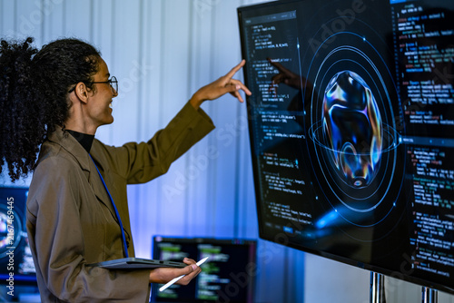 Obraz na płótnie Brazilian AI architect demonstrating advanced threat detection logic and predictive security models on an interactive visualization interface