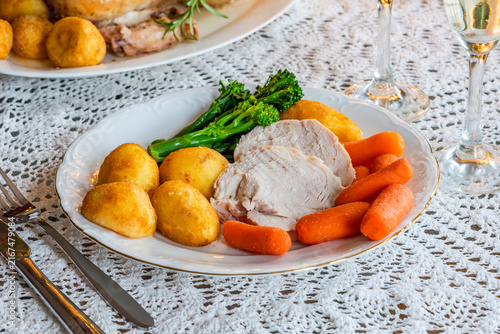 Christmas dinner with roast chicken, potatoes and vegetables