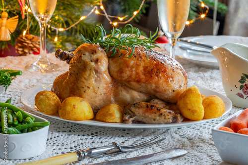 Christmas dinner with roast chicken, potatoes and vegetables