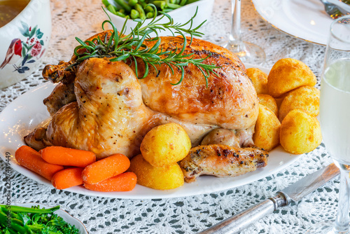 Christmas dinner with roast chicken, potatoes and vegetables