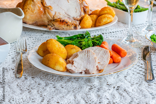 Christmas dinner with roast chicken, potatoes and vegetables