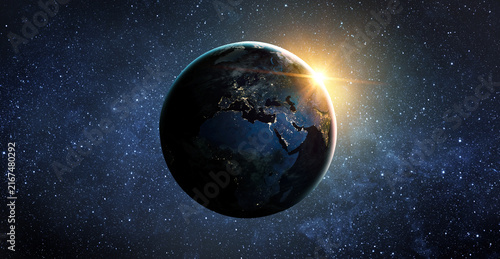 Fotografía View from space of the sunrise over planet Earth