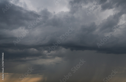 Obraz na plátně Dark storm clouds heavy sky background, dramatic thunderstorm cumulus cloudscape before rain, moody weather forecast backdrop, threatening hurricane or cyclone danger conceptual nature wallpaper