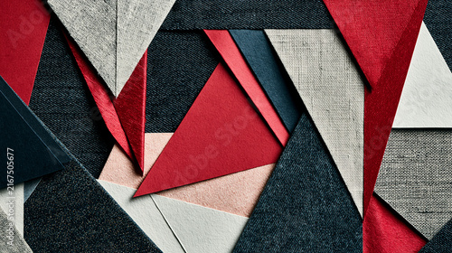 Collage of colorful origami shapes on textured surface