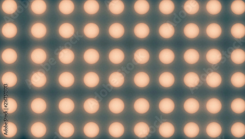 LED light panel with rows of bright bulbs on a dark background  