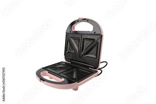 Fotografía An open pink sandwich toastie maker reveals its black non-stick triangle plates and hinge, photographed on a plain white background