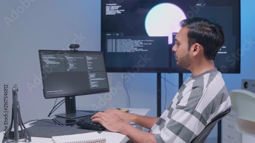 Software engineer wearing casual clothing typing on keyboard desktop computer information AI, management cybersecurity or coding software development. Programmer adult working artificial intelligence
