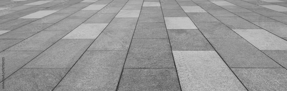 Fototapeta premium empty stone floor top in perspective. grey tile floor background in perspective view. line. empty copy space stone street. pavement. Granite outdoor tiled floor. gray granite. Marble texture