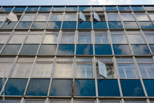 Modern office building facade with reflective glass windows