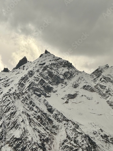 Canvas Print Snow-Covered Rugged Mountain Peak in Winter Alpine Landscape