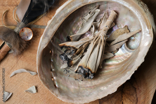 Canvastavla Top View of White Sage Leaves Smoldering in Abalone Shell with Feather