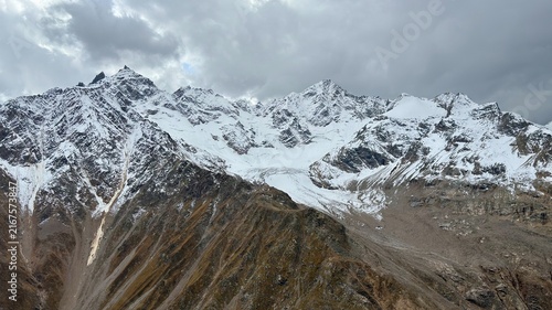 Fotografie Snow-Covered Rugged Mountain Peak in Winter Alpine Landscape