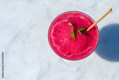 фотографія Enjoy a Refreshing Pink Smoothie, beautifully garnished with fresh Mint for an e