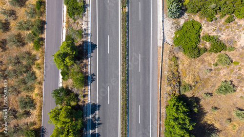 Top down aerial view of highway through Mediterranean landscape