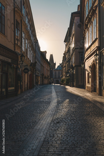 Golden Hour Cobblestone Street in Prague Old Town with Historic Buildings