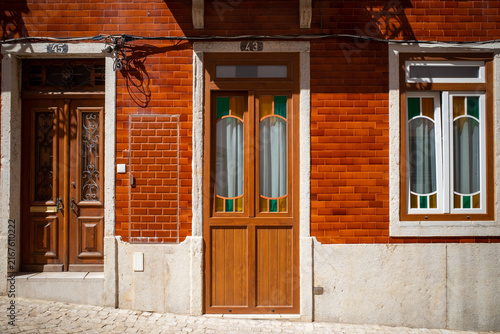 Mediterranean Style House Facade in Caramel Colored Tiles with Beautiful Door and Window