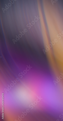 Blur illuminated glow. Purple color flare. Pink orange blue radiant texture optical rainbow neon flash on abstract art background.