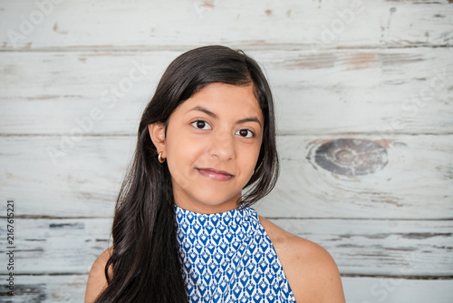 Teenage Girl Portrait with Warm Smile and Copy Space