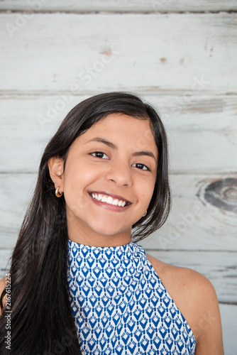 Teenage Girl Smiling Warmly, Close Up Portrait