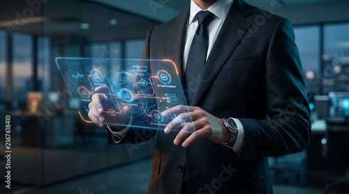 Businessman using futuristic hologram interface in modern office for corporate data management