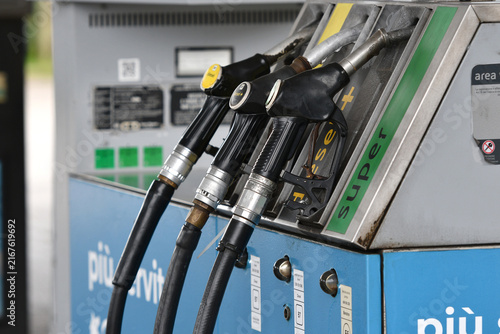 Konstfotografi Fuel pump nozzles at a service station