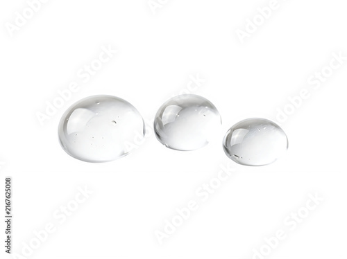 Three clear water drops of different sizes resting together in a row creating a clean liquid effect