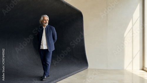 Mature Brand Consultant Inside a Monumental Wool Fold for Business Innovation Concept