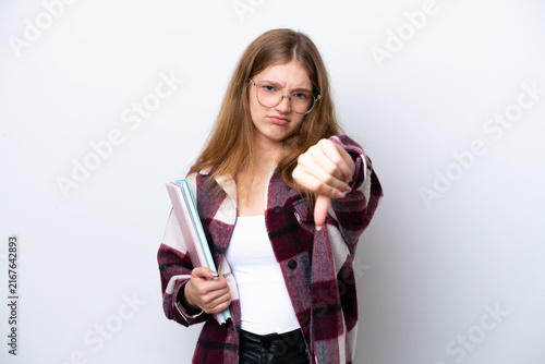 Фотография Teenager student Russian girl isolated on white background showing thumb down wi