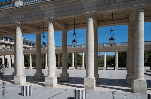 Columns and inner courtyard of the Palais Royal in Paris, France, on a sunny summer day
