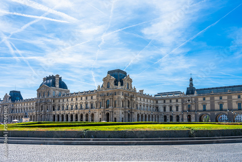 Visitors explore the Louvre museum in Paris, France during the summer months