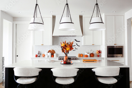 Beautiful modern black and white kitchen with Halloween cookware and decor display
