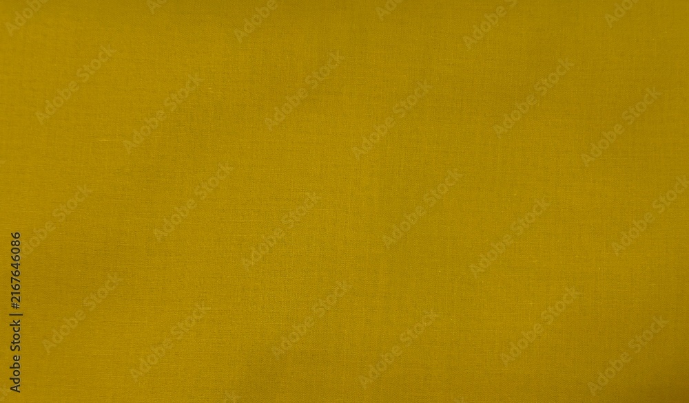 Fototapeta premium Mustard yellow fabric textile texture background, suitable for design, web usage, and creative projects.