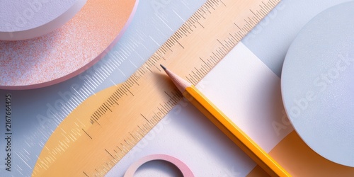 Geometric shapes on paper featuring a ruler, pencil, and eraser