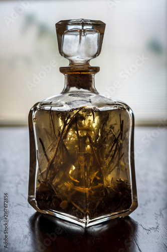 Bottle with herbs infusion