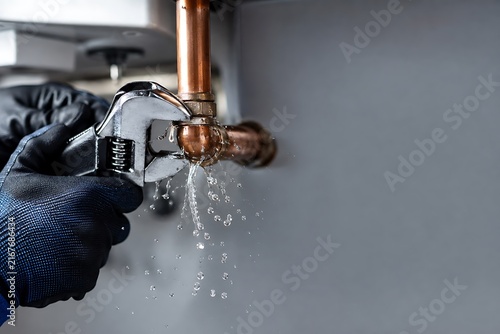 Leaking copper pipe with water dripping